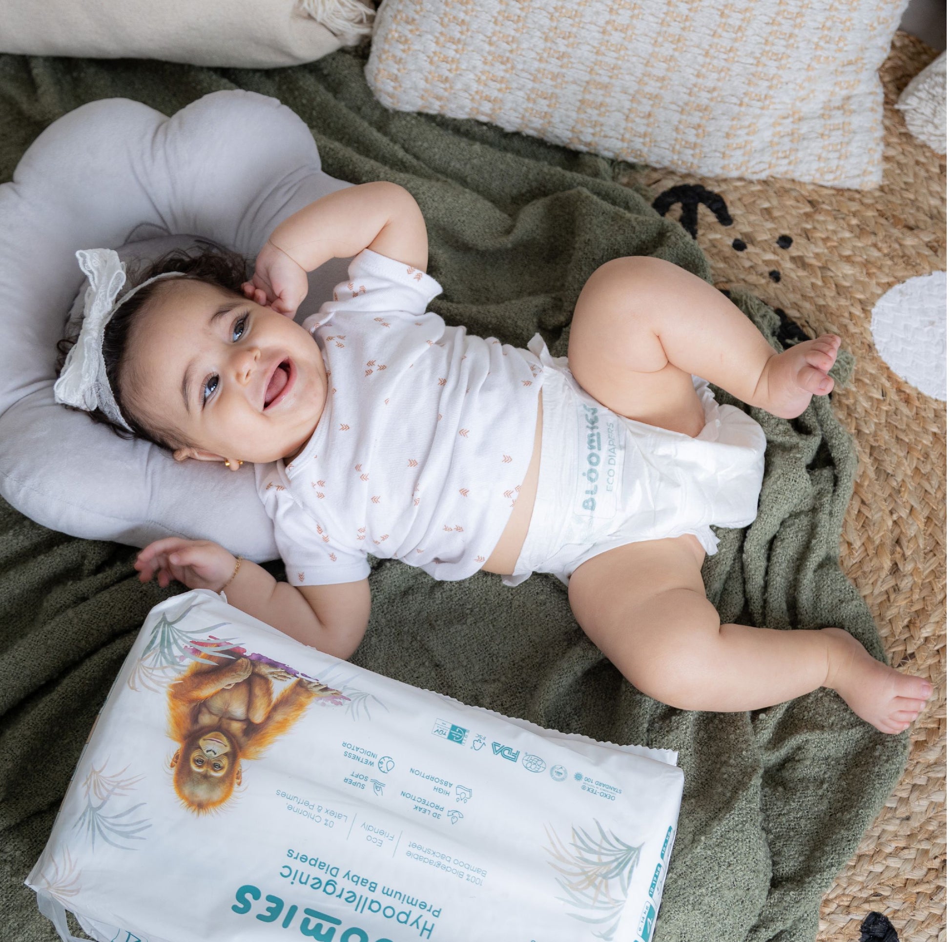Premium Baby Diapers - smiling baby wearing diaper